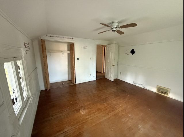 705 Campbell St, Joliet, IL 60435 - unfurnished bedroom with lofted ceiling, wood finished floors, a closet, and a ceiling fan