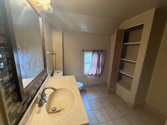 705 Campbell St, Joliet, IL 60435 - bathroom featuring toilet, tile patterned floors, and vanity