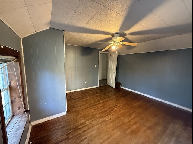 705 Campbell St, Joliet, IL 60435 - unfurnished room featuring wood finished floors, ceiling fan, baseboards, and lofted ceiling