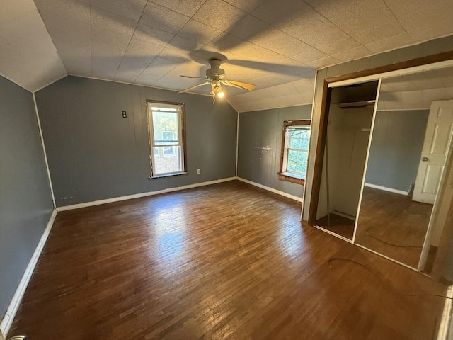 705 Campbell St, Joliet, IL 60435 - unfurnished bedroom featuring lofted ceiling, wood finished floors, baseboards, a ceiling fan, and a closet