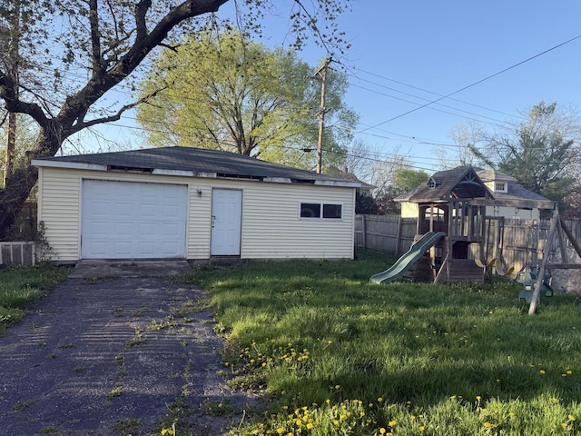 705 Campbell St, Joliet, IL 60435 - detached garage featuring asphalt driveway and central AC unit