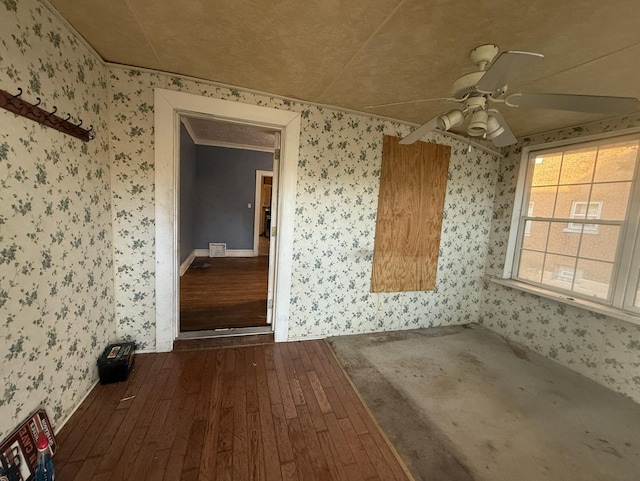 705 Campbell St, Joliet, IL 60435 - unfurnished dining area with wallpapered walls, dark wood-style flooring, a ceiling fan, and baseboards