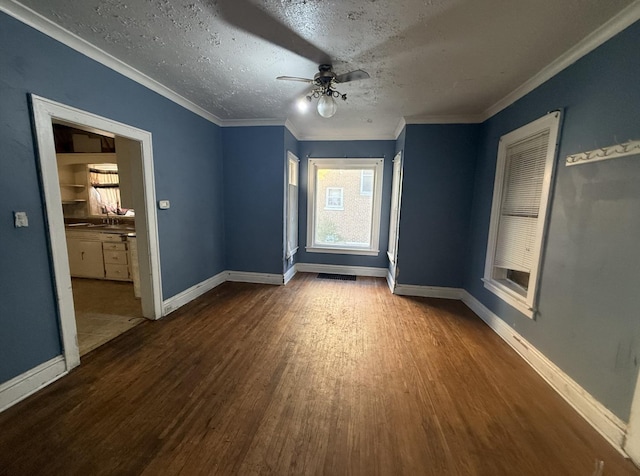 705 Campbell St, Joliet, IL 60435 - spare room with wood finished floors, baseboards, a ceiling fan, a textured ceiling, and crown molding