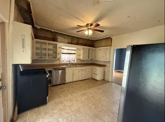 705 Campbell St, Joliet, IL 60435 - kitchen with freestanding refrigerator, dishwasher, black gas stove, a sink, and a ceiling fan