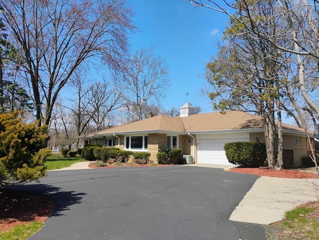 17W120 Woodland Ave, Bensenville, IL 60106 - single story home featuring an attached garage and driveway