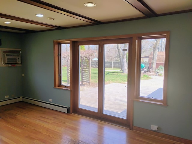 17W120 Woodland Ave, Bensenville, IL 60106 - doorway to outside featuring a wall unit AC, light wood finished floors, recessed lighting, a baseboard radiator, and baseboards