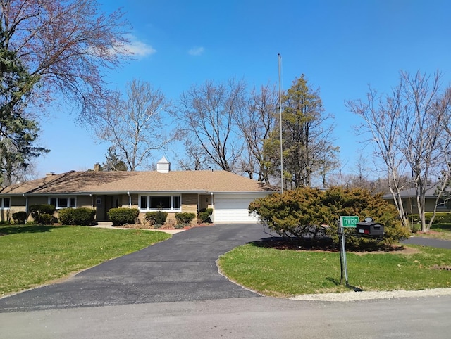 17W120 Woodland Ave, Bensenville, IL 60106 - ranch-style home with a garage, a front lawn, and driveway