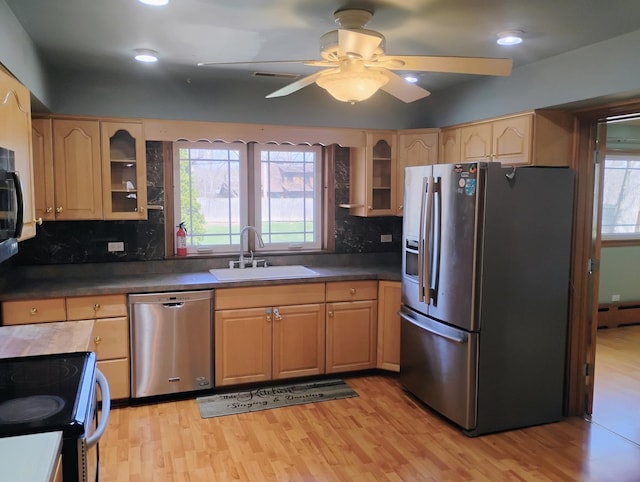 17W120 Woodland Ave, Bensenville, IL 60106 - kitchen with stainless steel appliances, a sink, light wood-type flooring, tasteful backsplash, and recessed lighting