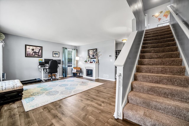 1651 Glenbrooke Ln, New Lenox, IL 60451 - living area with wood finished floors, stairway, a glass covered fireplace, and baseboards