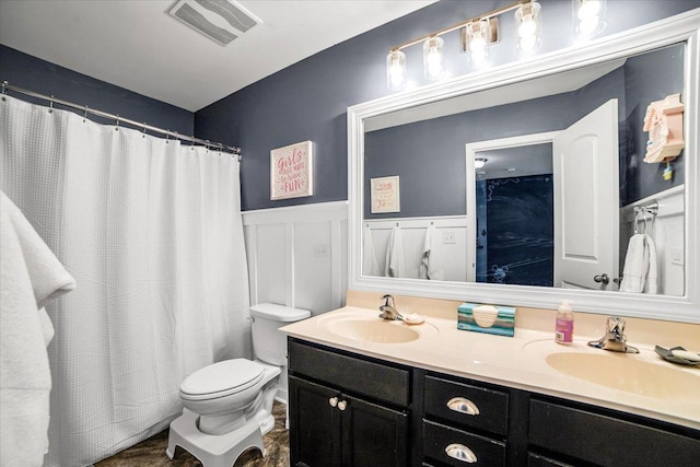 1651 Glenbrooke Ln, New Lenox, IL 60451 - full bathroom with toilet, double vanity, a wainscoted wall, curtained shower, and a decorative wall