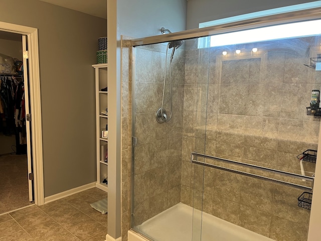 1651 Glenbrooke Ln, New Lenox, IL 60451 - bathroom featuring a spacious closet, a stall shower, and tile patterned floors