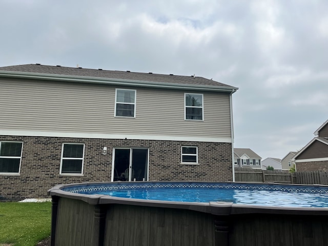 1651 Glenbrooke Ln, New Lenox, IL 60451 - rear view of property with an outdoor pool and brick siding