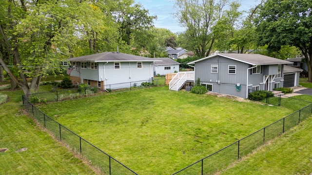 300 N 3rd St, Elburn, IL 60119 - view of yard with stairs, a wooden deck, and a garage