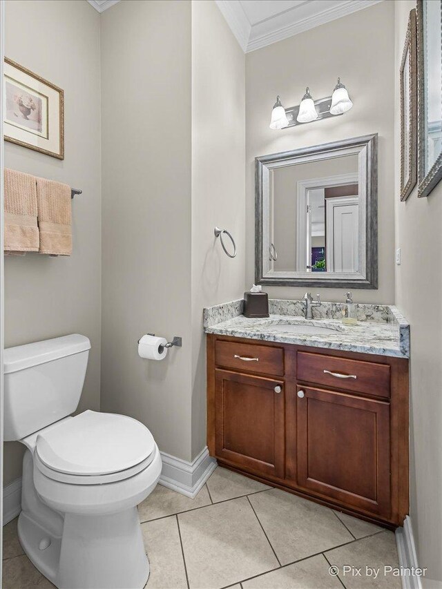 195 E Clover Ave, Cortland, IL 60112 - half bath featuring ornamental molding, toilet, vanity, baseboards, and tile patterned flooring