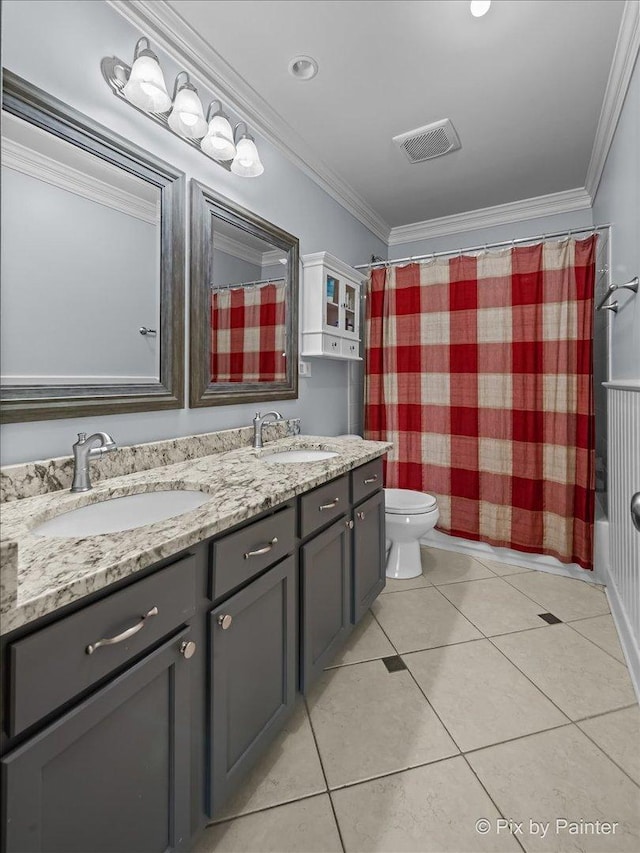 195 E Clover Ave, Cortland, IL 60112 - full bathroom featuring double vanity, toilet, ornamental molding, and tile patterned floors