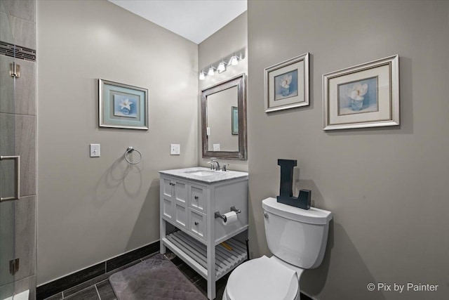 195 E Clover Ave, Cortland, IL 60112 - bathroom featuring toilet, vanity, baseboards, and a shower with shower door