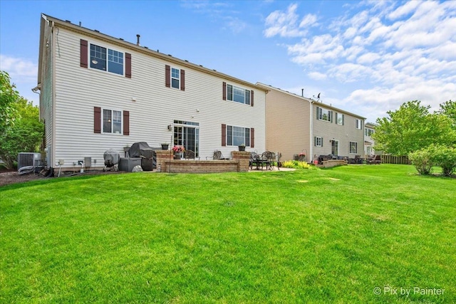 195 E Clover Ave, Cortland, IL 60112 - back of house with a lawn, a patio area, and cooling unit