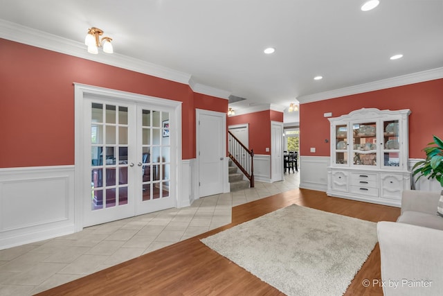 195 E Clover Ave, Cortland, IL 60112 - tiled living room featuring french doors, stairway, wainscoting, and ornamental molding