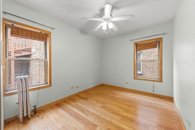 405 S Harvey Ave Unit 2A, Oak Park, IL 60302 - spare room with plenty of natural light, light wood finished floors, ceiling fan, and baseboards