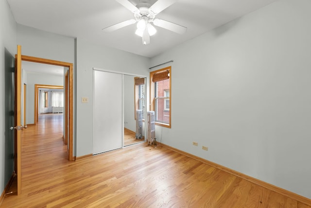 405 S Harvey Ave Unit 2A, Oak Park, IL 60302 - unfurnished bedroom with light wood-type flooring, baseboards, a closet, and a ceiling fan