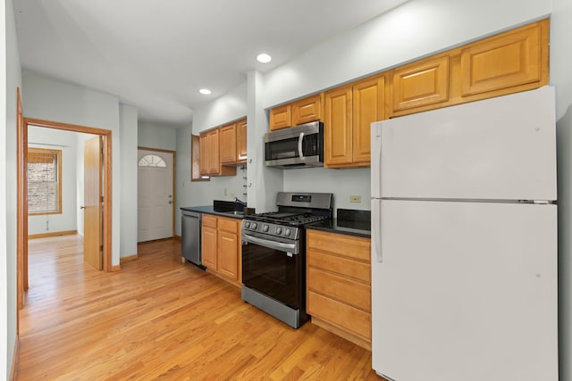 405 S Harvey Ave Unit 2A, Oak Park, IL 60302 - kitchen with appliances with stainless steel finishes, dark countertops, light wood-style flooring, recessed lighting, and a sink