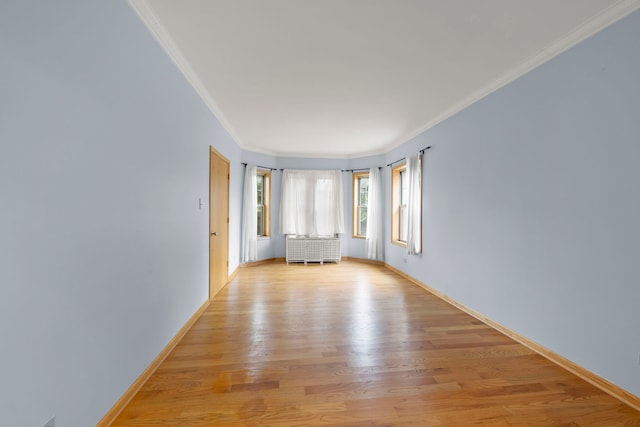 405 S Harvey Ave Unit 2A, Oak Park, IL 60302 - empty room with crown molding, light wood finished floors, radiator heating unit, and baseboards