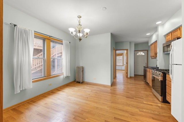 405 S Harvey Ave Unit 2A, Oak Park, IL 60302 - kitchen featuring radiator, appliances with stainless steel finishes, a chandelier, light wood-style floors, and recessed lighting