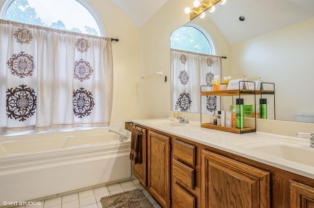 5932 N Sauganash Ln, Chicago, IL 60646 - bathroom with vaulted ceiling, double vanity, a garden tub, tile patterned flooring, and toilet