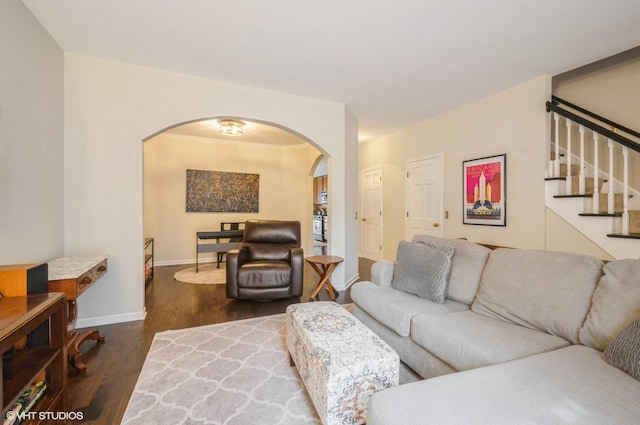 5932 N Sauganash Ln, Chicago, IL 60646 - living room featuring arched walkways, wood finished floors, stairway, and baseboards