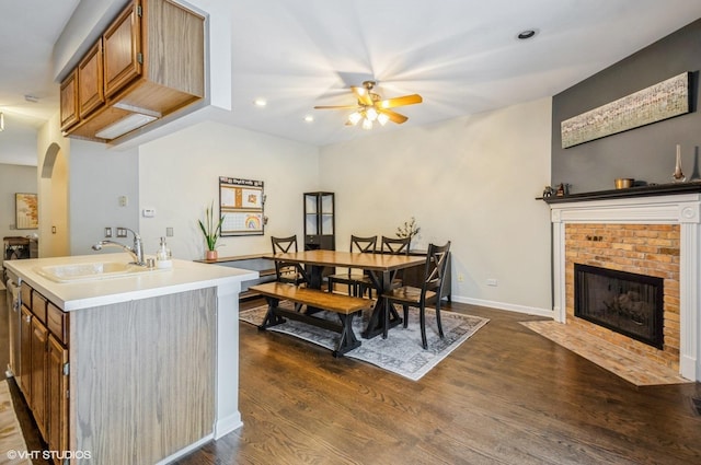 5932 N Sauganash Ln, Chicago, IL 60646 - dining room with ceiling fan, arched walkways, dark wood-type flooring, recessed lighting, and a fireplace