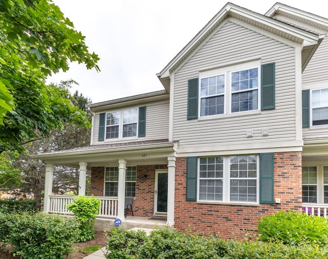 681 W Moreland Ave, Addison, IL 60101 - view of front of house featuring brick siding and a porch