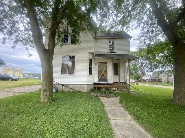 131 S 3rd St, Oregon, IL 61061 - view of front facade featuring a front yard