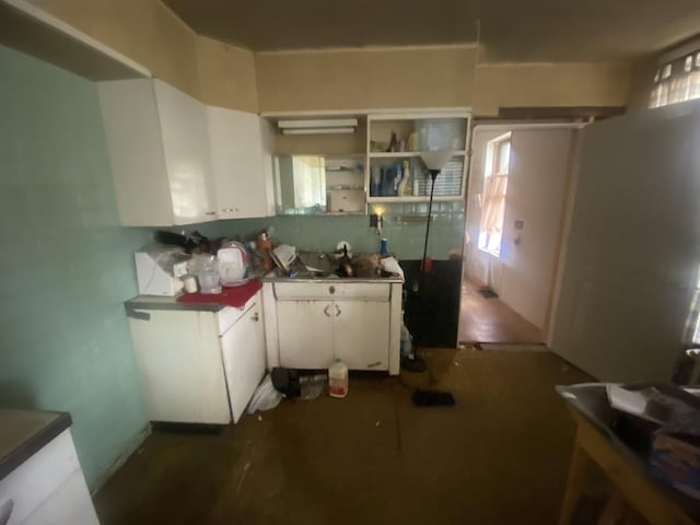 131 S 3rd St, Oregon, IL 61061 - kitchen with white cabinetry and a sink