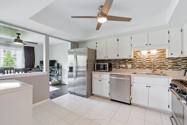 7811 W 157th St Unit 2N, Orland Park, IL 60462 - kitchen with appliances with stainless steel finishes, ceiling fan, a sink, and backsplash