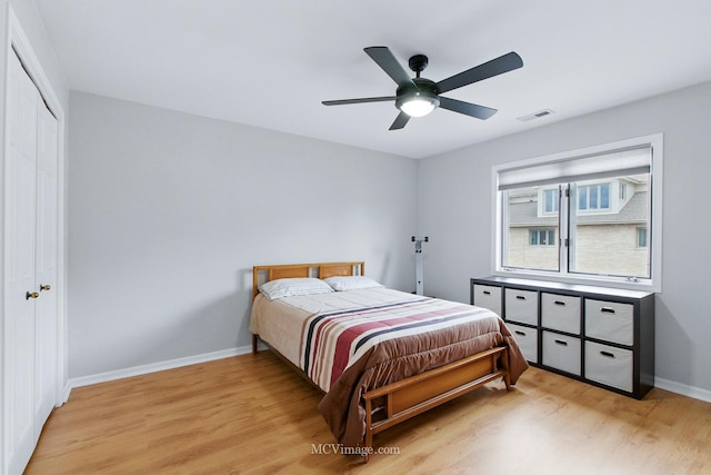 7811 W 157th St Unit 2N, Orland Park, IL 60462 - bedroom with light wood-type flooring, baseboards, a closet, and a ceiling fan