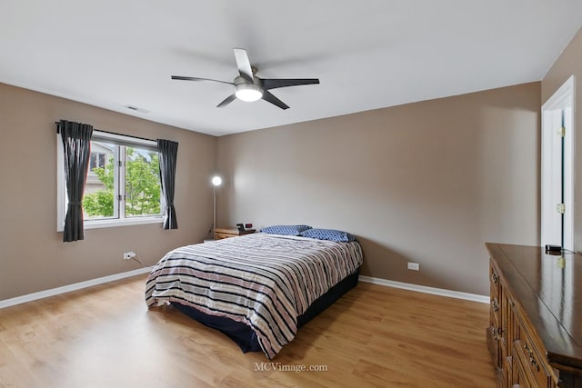 7811 W 157th St Unit 2N, Orland Park, IL 60462 - bedroom featuring light wood-style flooring, baseboards, and a ceiling fan