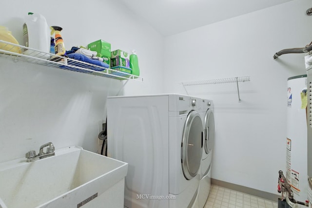 7811 W 157th St Unit 2N, Orland Park, IL 60462 - laundry area featuring independent washer and dryer, light floors, baseboards, and gas water heater
