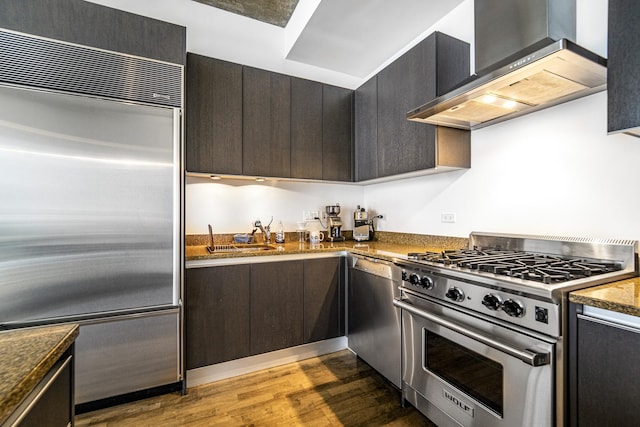 600 N Fairbanks Ct Unit 2503, Chicago, IL 60611 - kitchen with high quality appliances, wall chimney range hood, wood finished floors, a sink, and modern cabinets