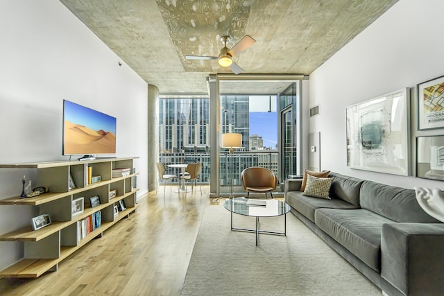 600 N Fairbanks Ct Unit 2503, Chicago, IL 60611 - living room featuring floor to ceiling windows, wood finished floors, and a ceiling fan