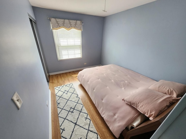 271 E Cleburne Ave, Bartlett, IL 60103 - bedroom with light wood-style floors and baseboards