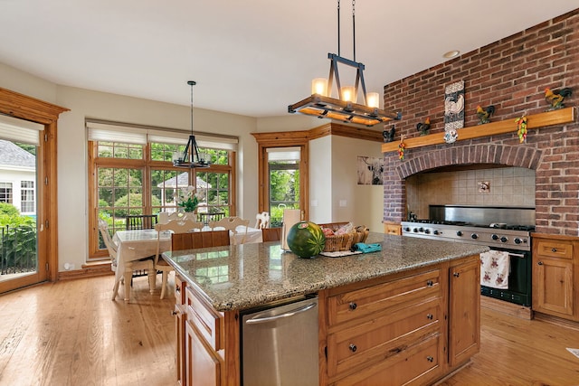 10731 Somonauk Rd, Hinckley, IL 60520 - kitchen featuring stainless steel appliances, a chandelier, light wood-type flooring, and a kitchen island