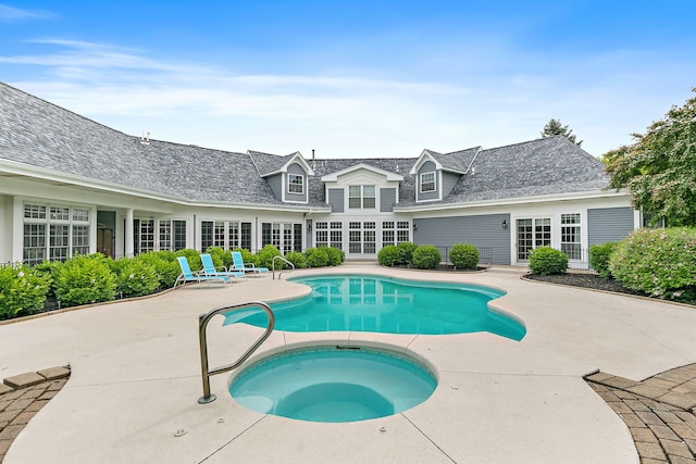 10731 Somonauk Rd, Hinckley, IL 60520 - outdoor pool featuring an in-ground hot tub, french doors, and a patio area