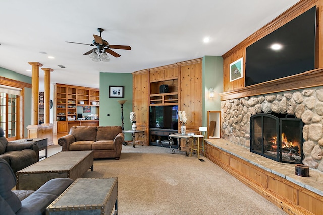 10731 Somonauk Rd, Hinckley, IL 60520 - carpeted living area featuring ceiling fan, a stone fireplace, ornate columns, and recessed lighting