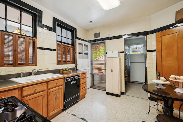 3622 N Avers Ave, Chicago, IL 60618 - kitchen featuring dishwasher, a sink, brown cabinets, and tile walls