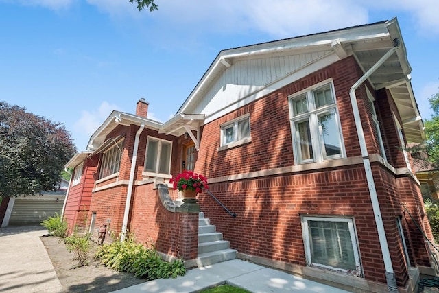3622 N Avers Ave, Chicago, IL 60618 - view of property exterior with brick siding and a chimney
