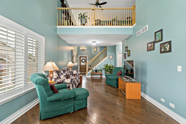 18120 Waterside Cir Unit 18120, Orland Park, IL 60467 - living room featuring a high ceiling, stairway, ceiling fan, wood finished floors, and a chandelier