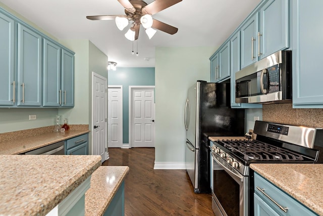 18120 Waterside Cir Unit 18120, Orland Park, IL 60467 - kitchen with stainless steel appliances, blue cabinets, dark wood finished floors, light countertops, and a ceiling fan