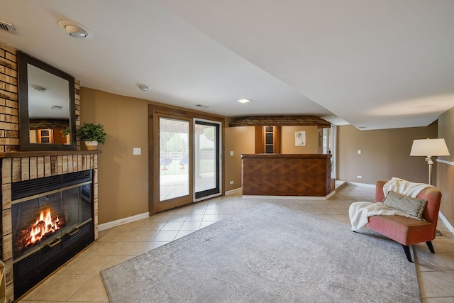 1068 Big Eagle Trl, Carol Stream, IL 60188 - living area featuring light tile patterned flooring, a glass covered fireplace, and baseboards