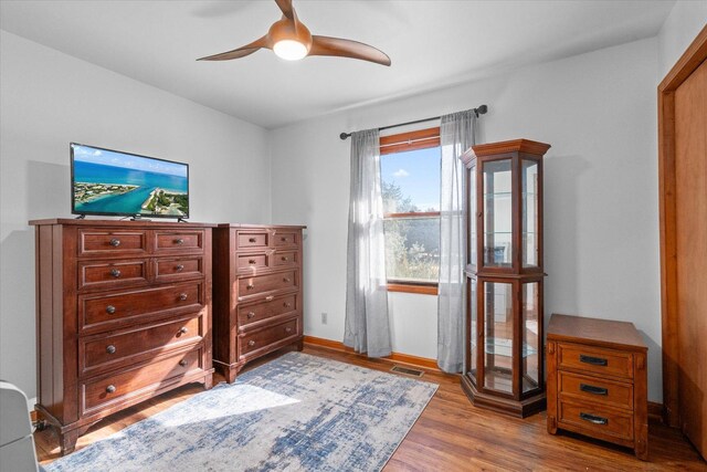 4461 N Il State Route 23, Leland, IL 60531 - bedroom with wood finished floors, baseboards, and a ceiling fan