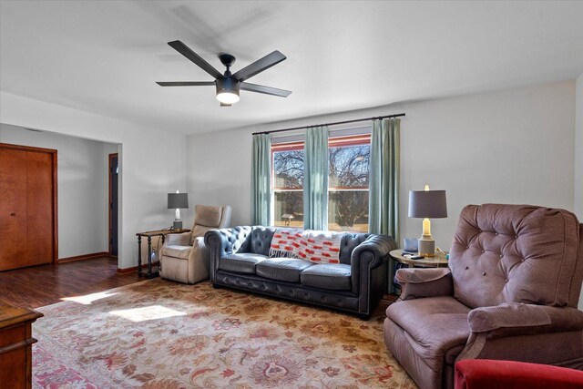 4461 N Il State Route 23, Leland, IL 60531 - living area featuring wood finished floors, a ceiling fan, and baseboards